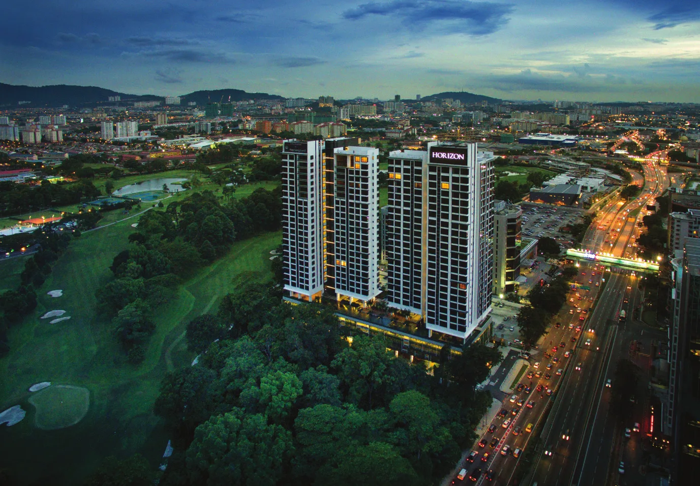AKASA Cheras South towers at dusk with the surrounding Klang Valley skyline, artist's impression