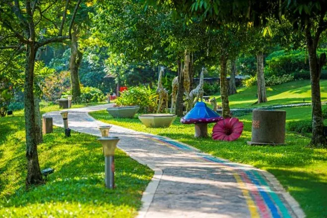 Park garden path with decorative mushroom sculptures at Central Park, Johor Bahru