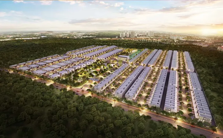 Danga Sutera township aerial at dusk with rows of double-storey homes and lit streets, artist's impression