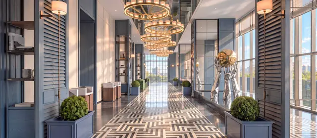 MABA Suitez grand lobby corridor with chandeliers and patterned floor, artist's impression