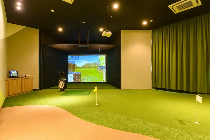 Virtual golf room with a putting green at Macrolink Medini