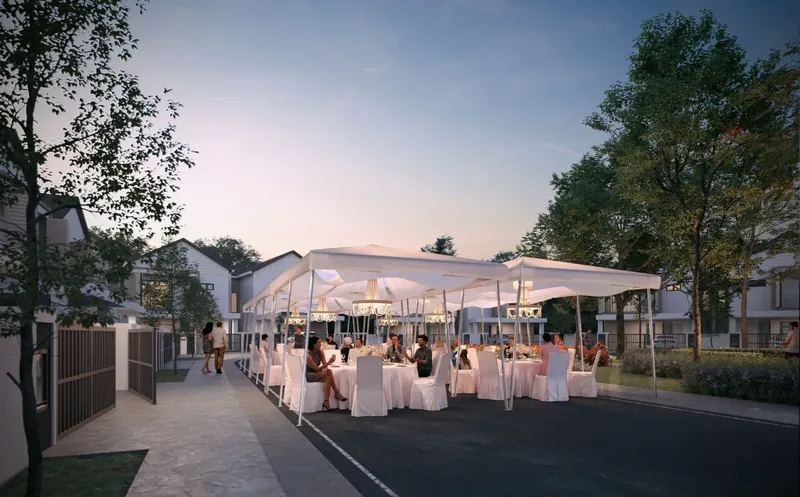 Long tables set up for a family gathering on the street beside the park at Myra Saujana, artist's impression