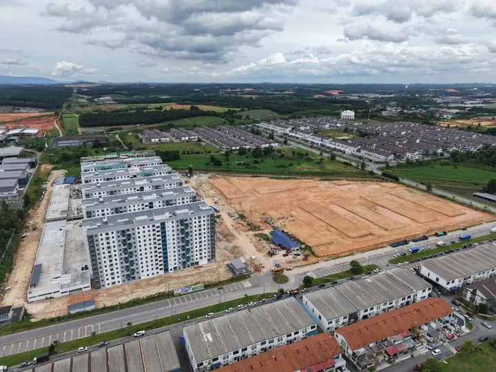 Aerial photo of the Sentrio Residence 2 site with the first phase blocks and cleared land beside the Senai industrial area