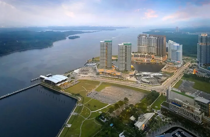 Aerial view of Puteri Harbour with the Southern Marina Residence towers beside the ferry terminal and the Straits of Johor