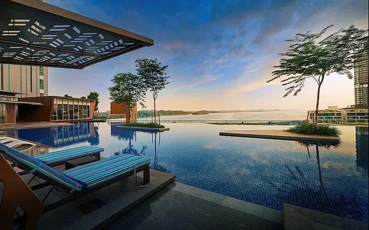 Infinity-edge pool deck at Southern Marina Residence looking over the marina