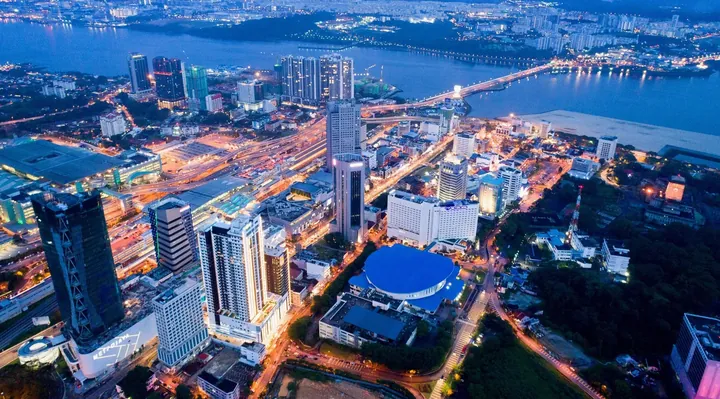 Night aerial view of Johor Bahru city centre showing Suasana Iskandar, the CIQ complex and the causeway to Singapore
